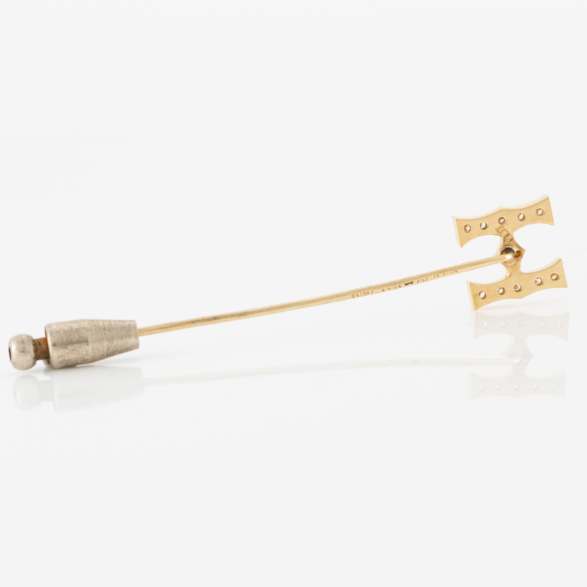 Kravattnål, i form av "H", 18K guld med briljantslipade diamanter.
