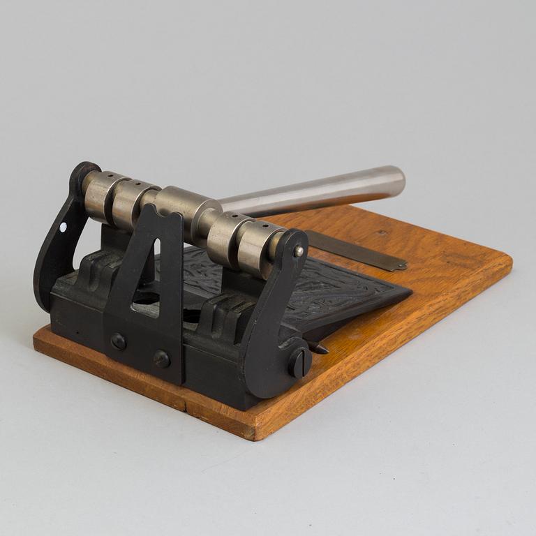 A early 20th century perforator.