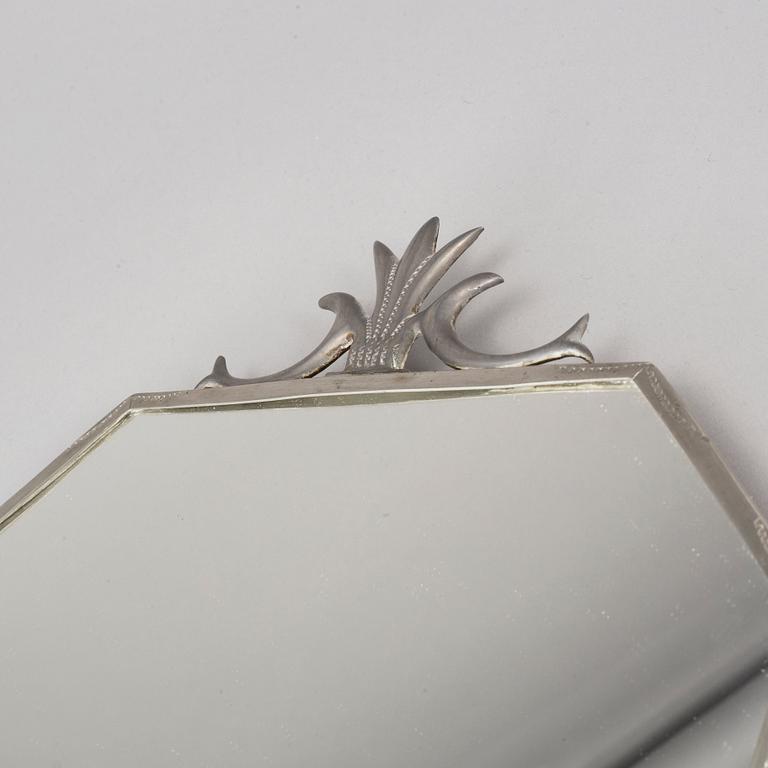 A pewter Art Deco mirror and a pair of wall scones, 1930s.