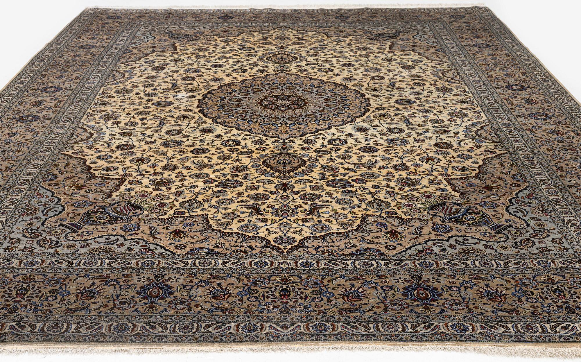 A semi-antique silk Keshan carpet, c. 350 x 248 cm.