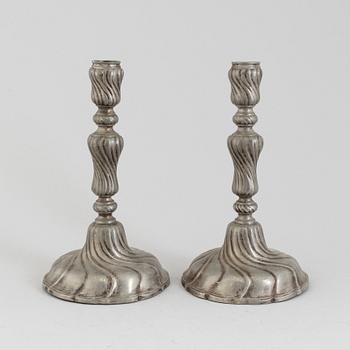 A PAIR OF ROCOCO PEWTER CANDLESTICKS, 18th century.