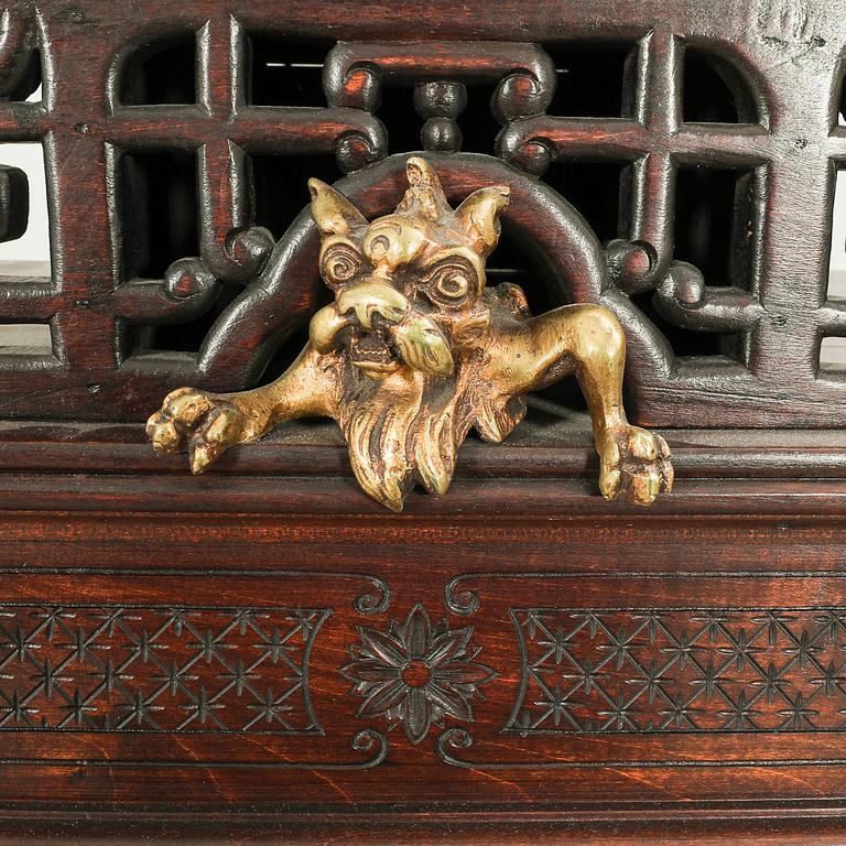 A Chinese style dark wood display cabinet first half of the 20th century.