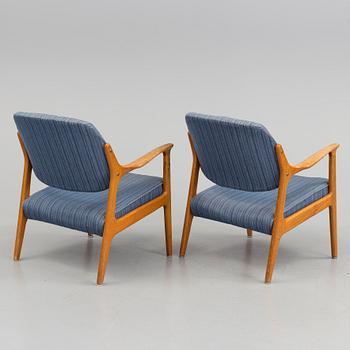 A pair of oak armchairs from Bröderna Andersson, mid 20th Century.