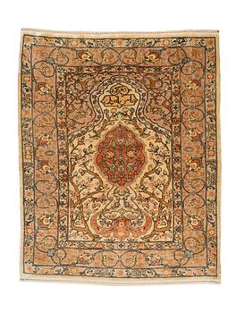 267. A rug, old silk Hereke, signed, ca 84,5 x 66 cm.