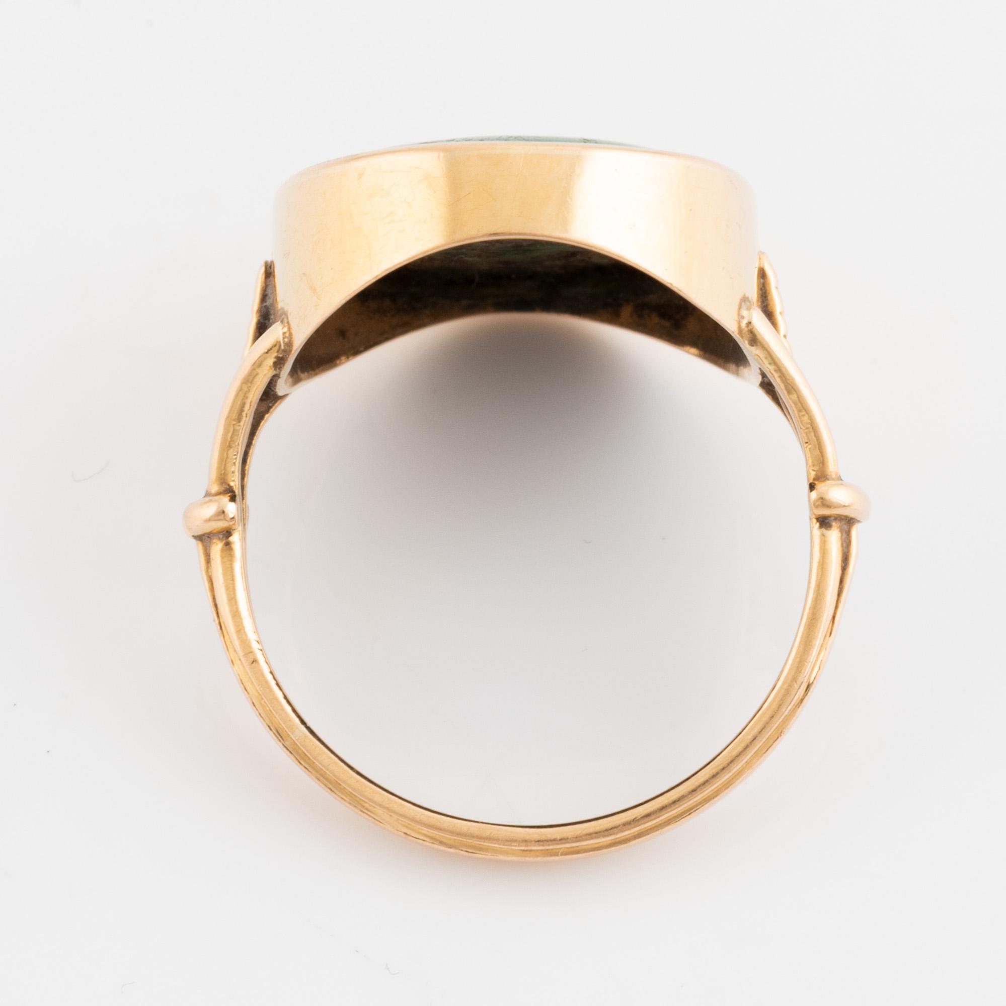 Green carved stone ring.