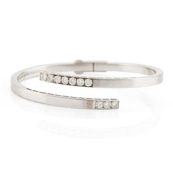 497. Rey Urban, a bangle, 18K white gold with round brilliant-cut diamonds, Stockholm 1965.