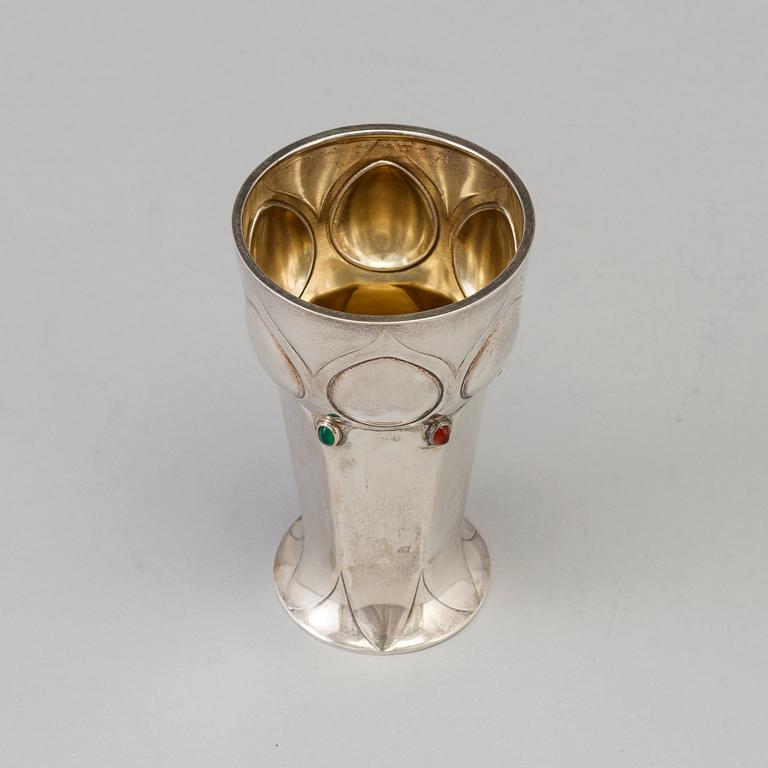 A Swedish Art Nouveau parcel-g beaker decorated with carneols and garnets, maker's mark Julia Anderson, Stockholm, 1909.