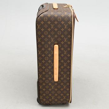 A Monogram Canvas Pégase 65 Suitcase with a Protective Cover.
