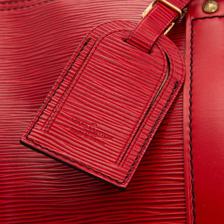 A RED EPI LEATHER KEEPALL TRAVEL BAG.