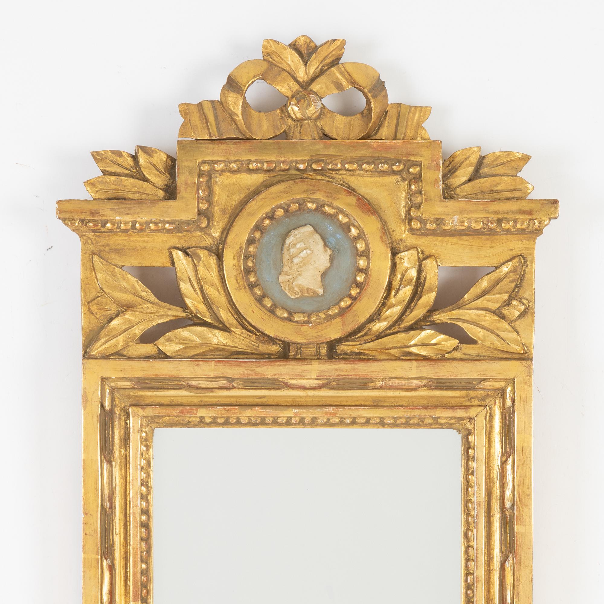 A Gustavian style mirror by John Lundmark, 20th Century.