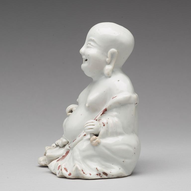 A blanc de chine figure of Buddai, Qing dynasty, 18th Century.