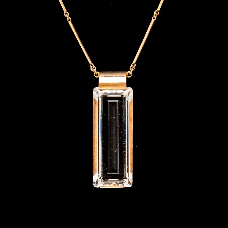 An 18K gold necklace set with a step cut rock crystal quartz by Ateljé Stigbert 1943.