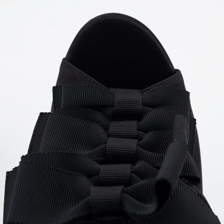 Yves Saint Laurent, a pair of black silk and bows platform sandals, size 37.