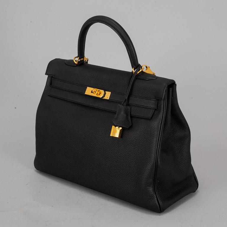 HERMÈS, a 'Kelly 35' black leather bag.