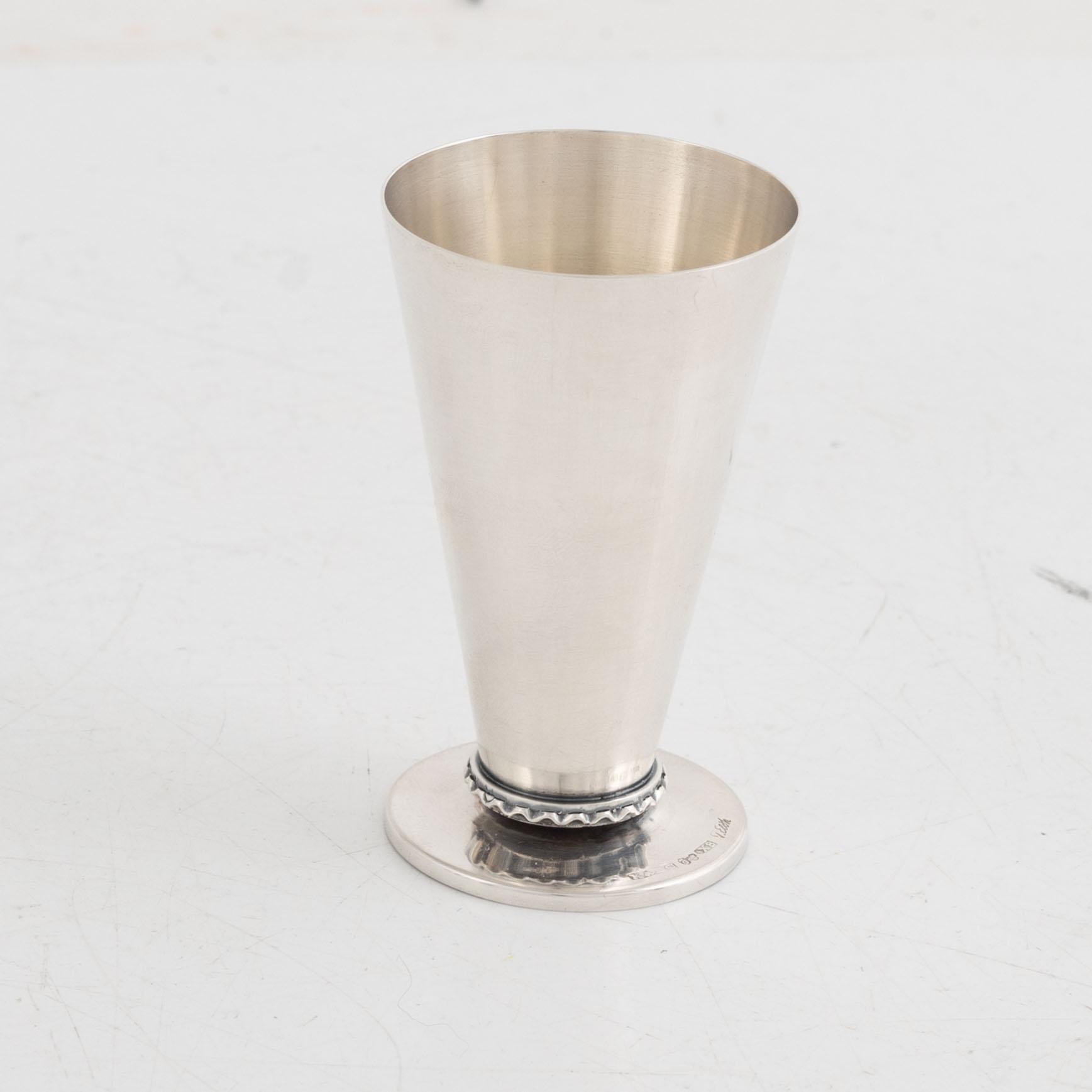 A silver candlestick, a beaker and a vase, including Gustaf Janson, CG Hallberg, Stockholm 1960.