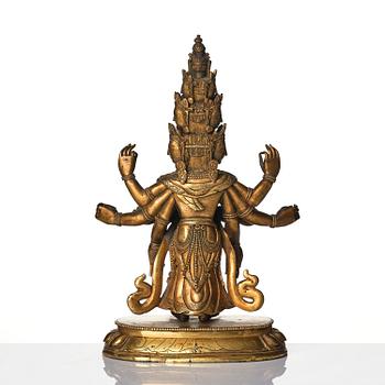 A Tibeto-Chinese gilt bronze figure of Avalokiteshvara Ekasdashamukra, 19th century.