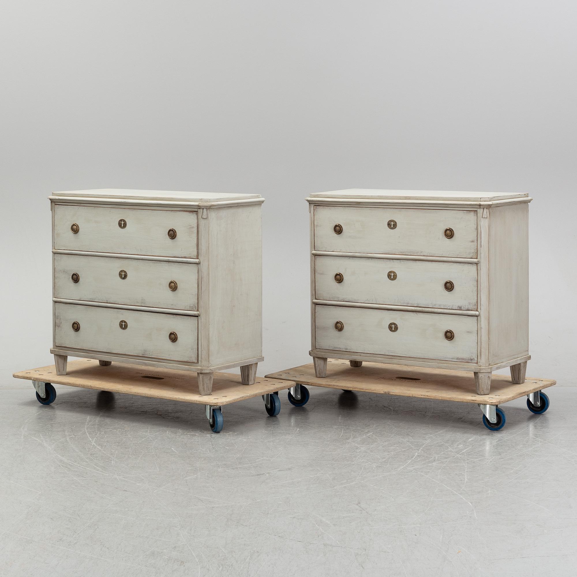 A pair of painted late gustavian-style chest of drawers.