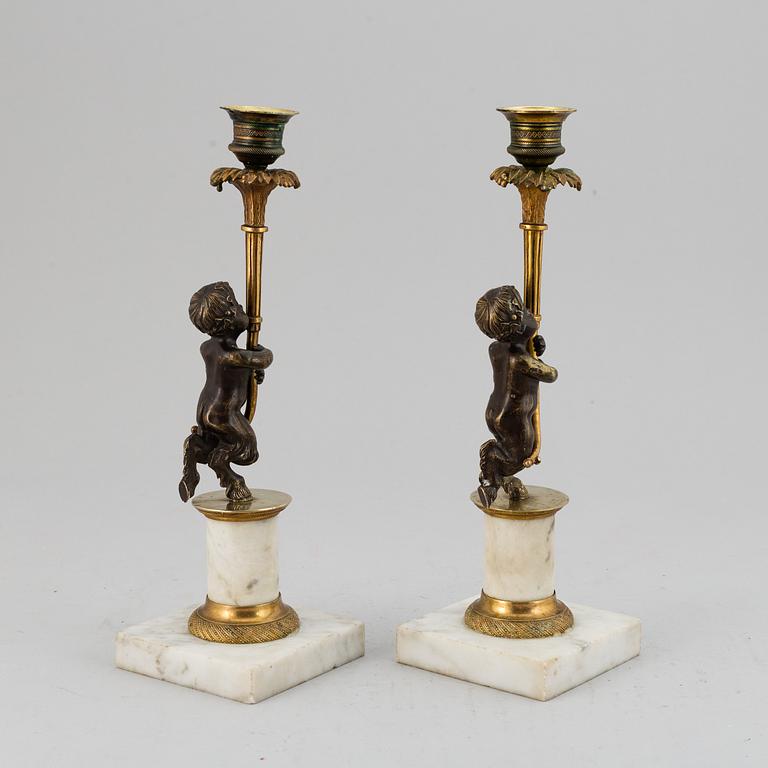 A pair of gustavian style candles sticks, circa 1900.