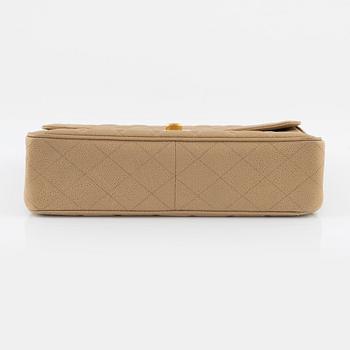 Chanel, a beige 'Caviar Jumbo Classic Flap Bag', vintage.