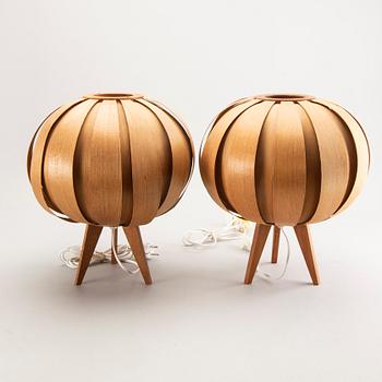 A pair of wooden table lamps.