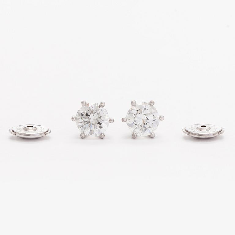 Bucherer, a pair of 18K white gold earrings with brilliant-cut diamond. SJL-certificate.