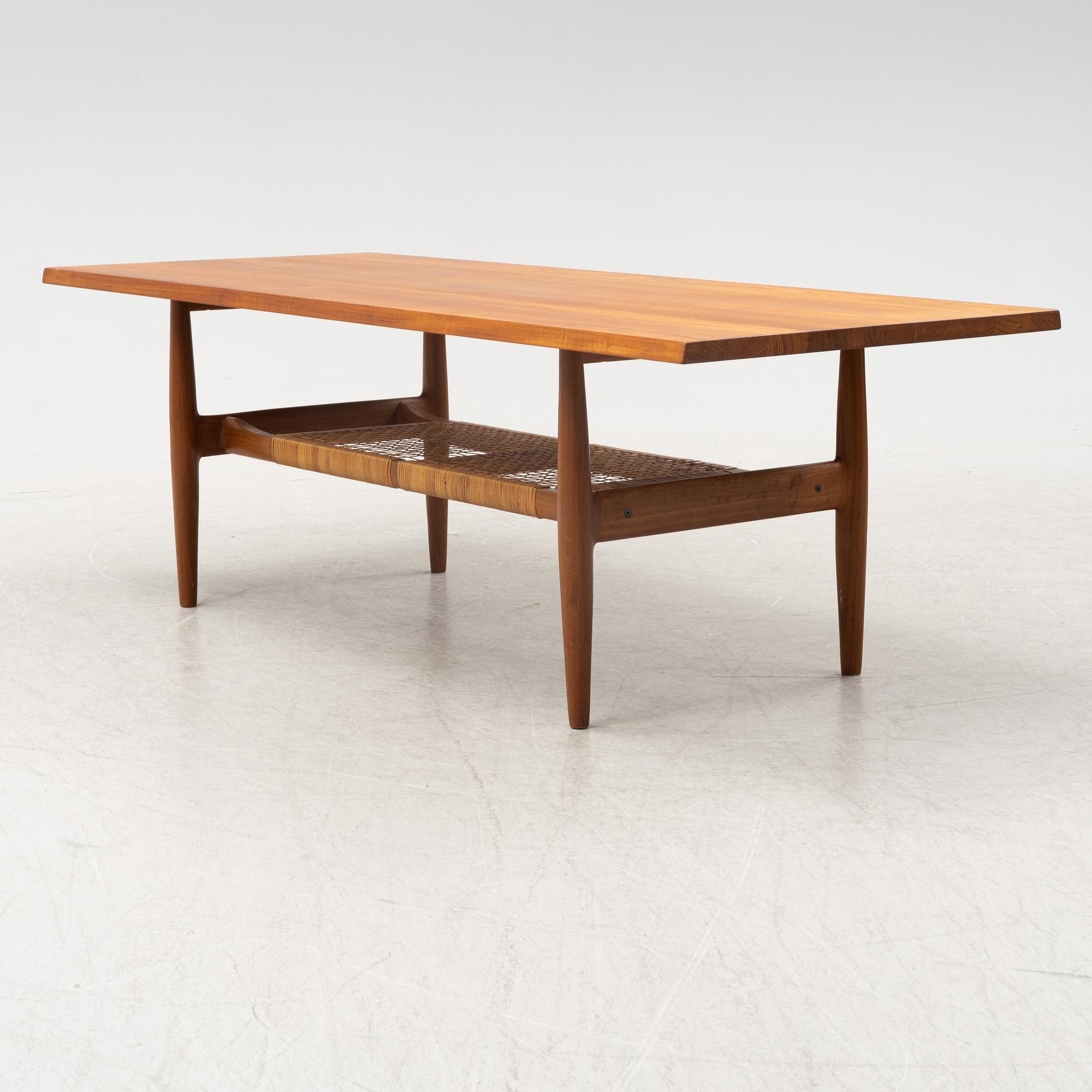 A composite teak coffee table with a rattan shelf, Denmark, 1950/60s.