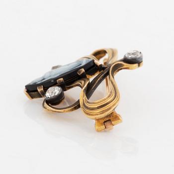 A Fedor Lorie brooch in gold and silver with a hardstone cameo and old-cut diamonds.