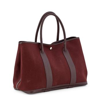 HERMÈS, a brown canvas and leather bag, "Garden Party".