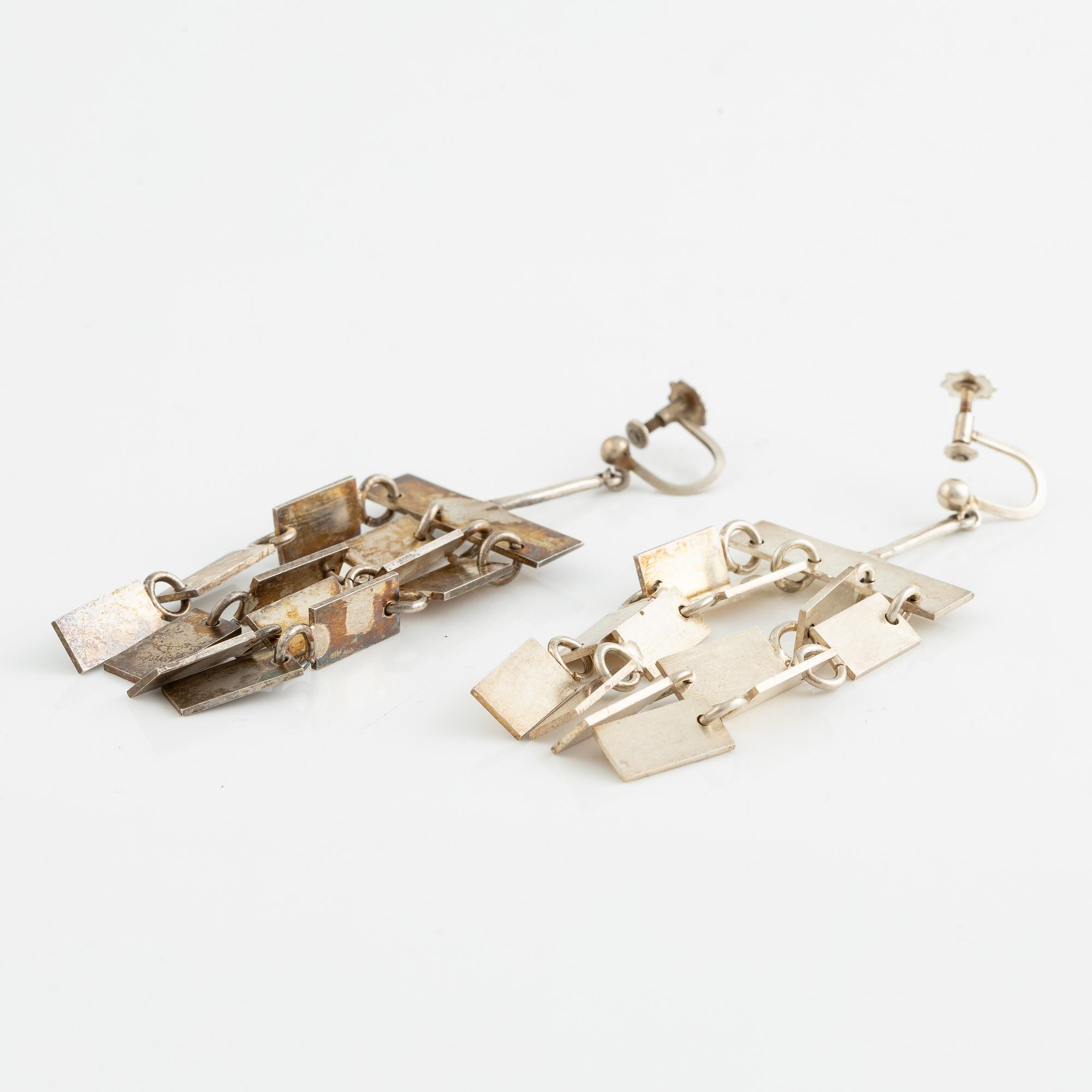 Lars Arby, a neck ring, two pendants and two pairs of earrings, silver, Gothenburg circa 1966, 1976, 1977 and 1980.