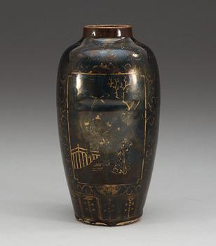A gilt black vase, Qing dynasty, 18th Century, with Kangxis six character mark.