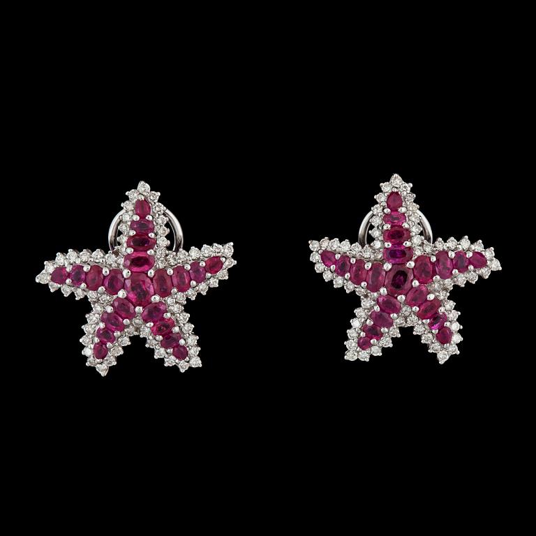 A pair of ruby and brilliant-cut diamond earrings in the shape of star fishes.