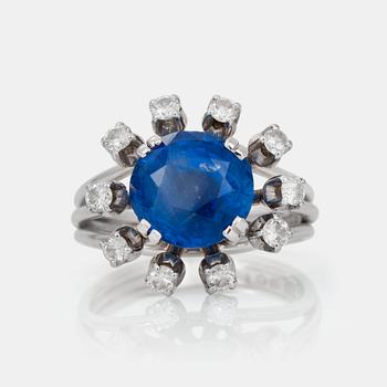 604. A sapphire and brilliant-cut diamond ring.