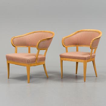 Two similar armchairs by Carl Malmsten, "Jonas love", second half of the 20th century.