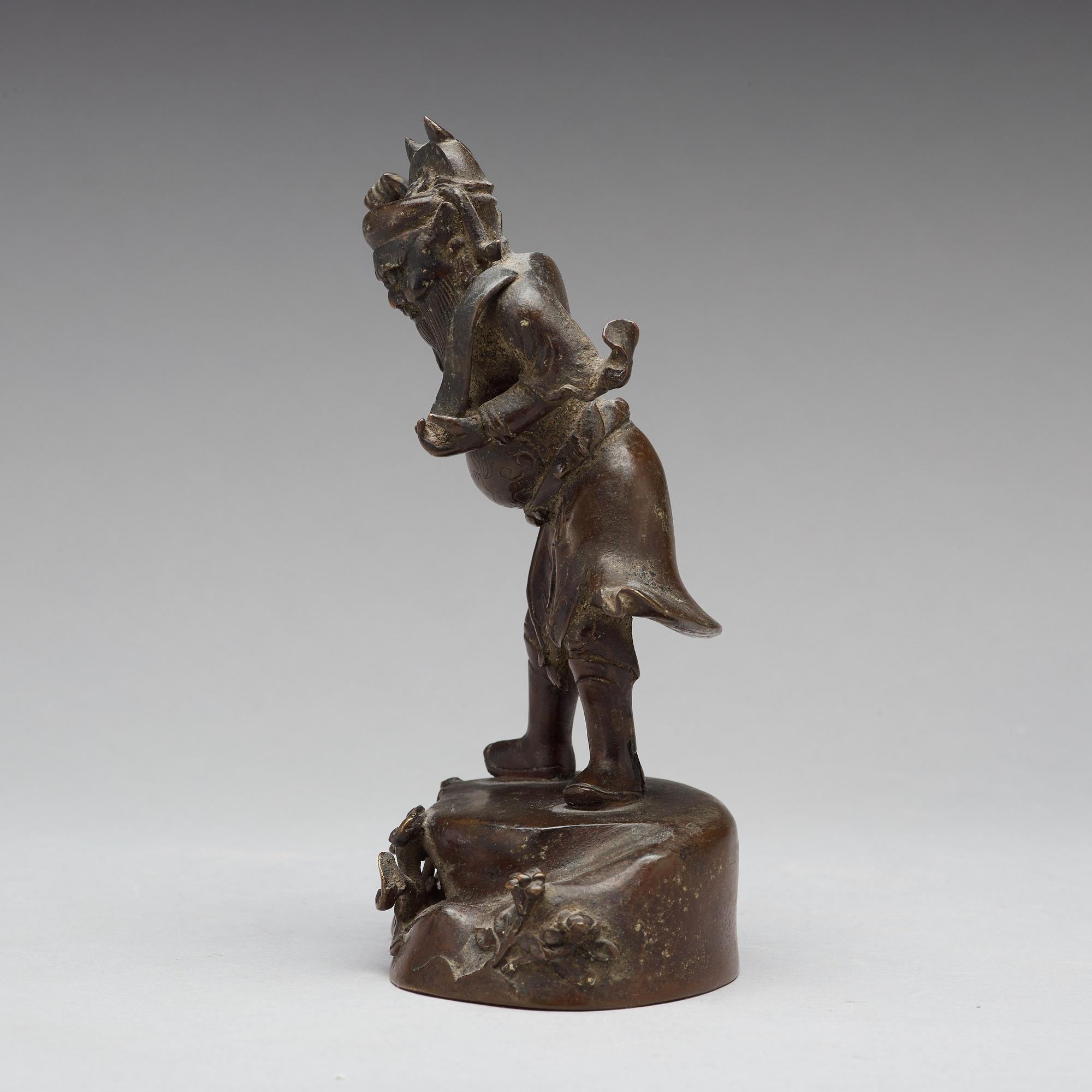 A bronze figure of a deity, Qing dynasty, 17/18th Century.