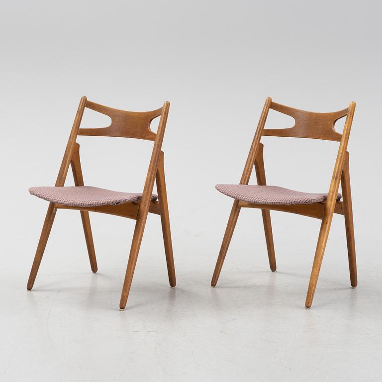 A set of six model CH 29 'Savbukstolen' by Hans J Wegner, designed 1952.