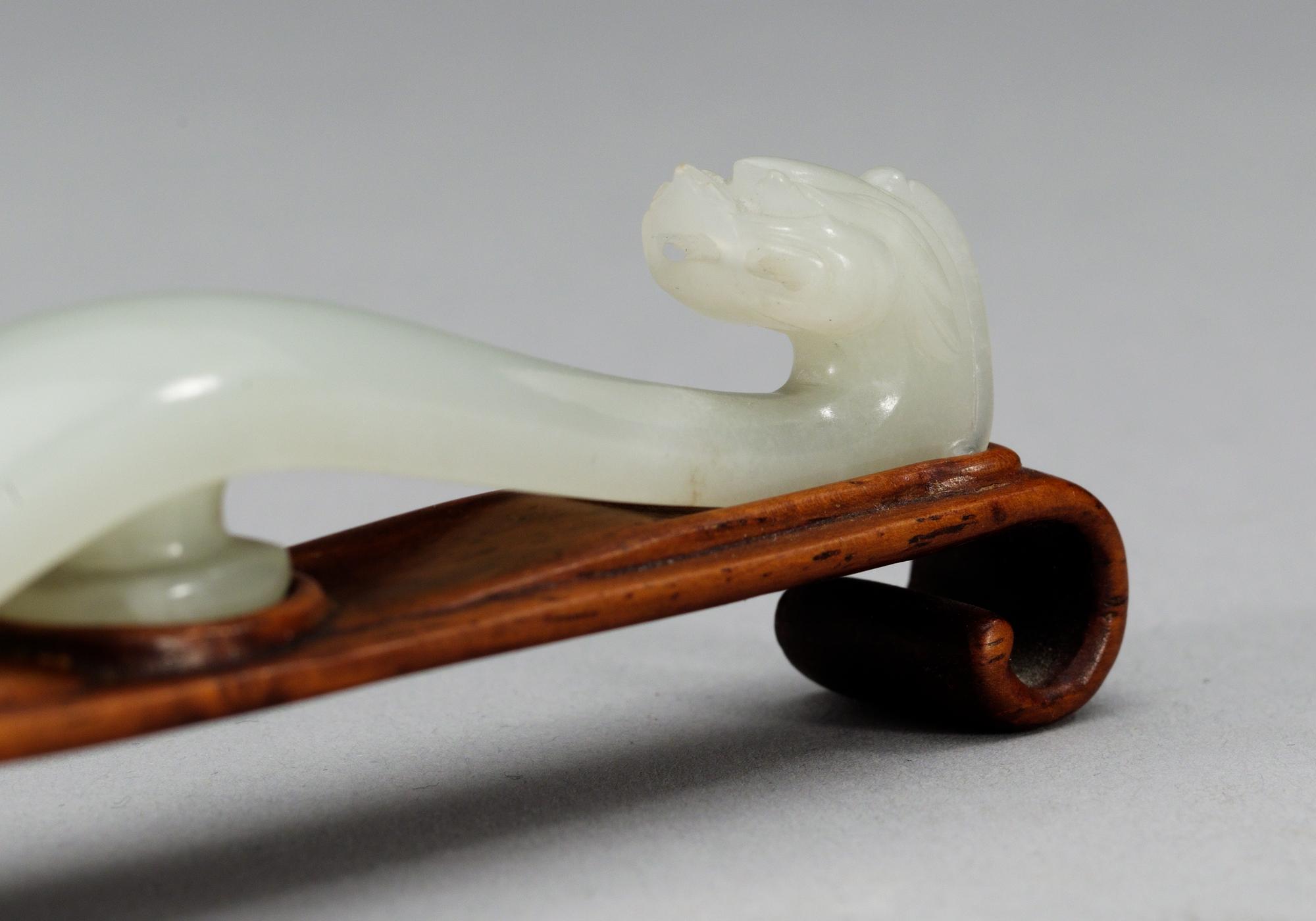 A Chinese jade belt clasper.