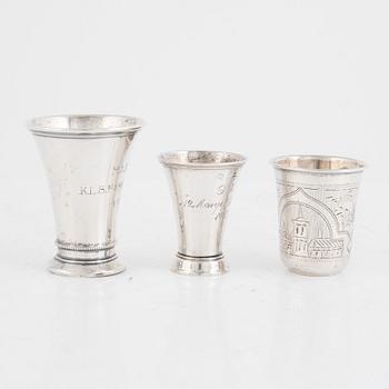 A set of five silver beakers, including MGAB, Stockholm 1946.