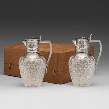 105. A pair of Fabergé jugs, glass and silver, Moscow 1899-1908, scratched inventori number 20116.