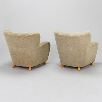 A pair of mid-20th century armchairs.