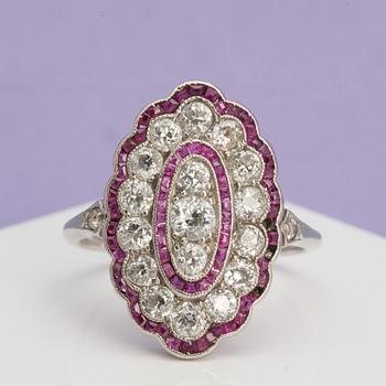 A ca 0.95 cts old-cut diamond ring with faceted rubies.