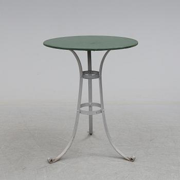 A garden table and four chairs, first half of the 20th century.