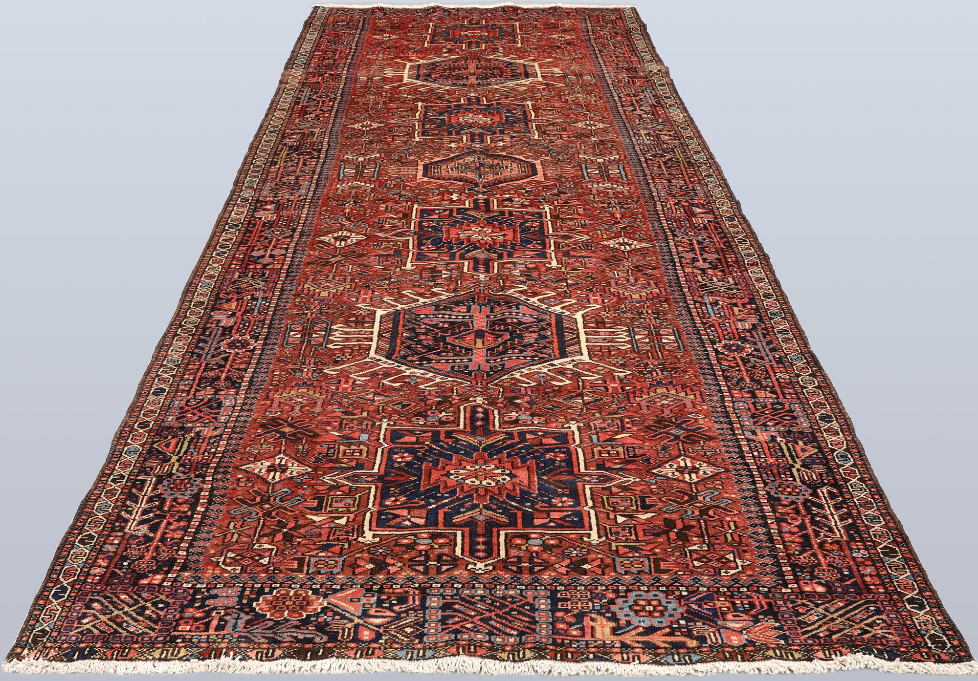 A semi-antique Garadje runner, approx. 425 x 148 cm.