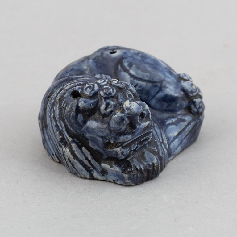 A blue glazed figure of a buddhist lion, Qing dynasty, Qianlong (1736-95).