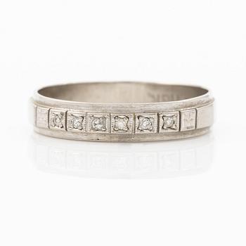 Half-hoop ring in 18K white gold set with small eight-cut diamonds.