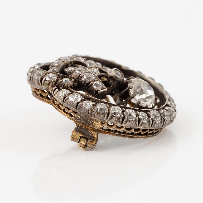 A brooch, silver and gold set with old-cut diamonds.