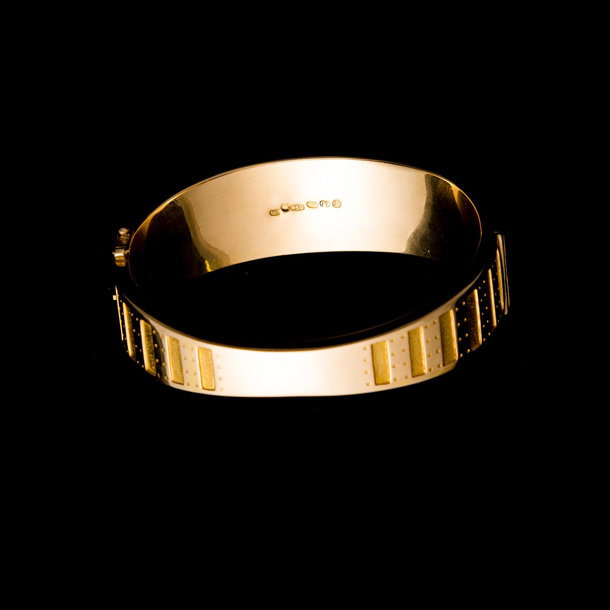 ARMBAND, "Metsäpirtti" 18K guld, Kalevala Koru 1962. Original etui. Vikt 44,5 g.