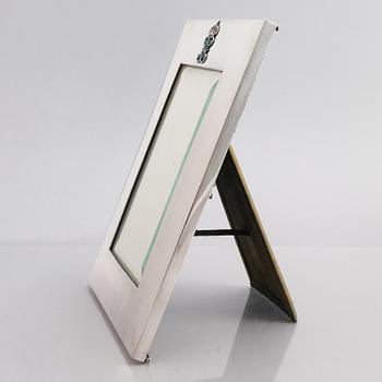 A silver and enamel frame with glass, mark of CG Hallberg, Stockholm 1935.