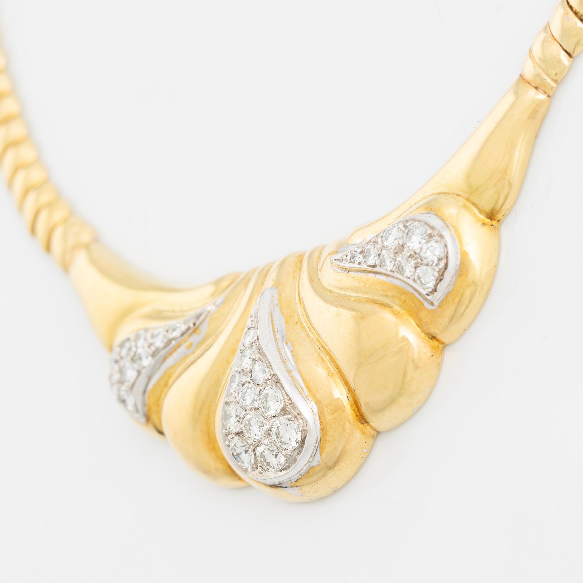 An 18K gold necklace set with round brilliant-cut diamonds.