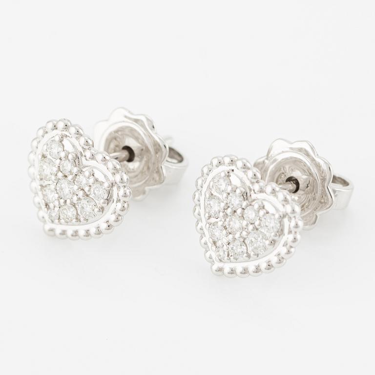 Heart-shaped earrings with brilliant-cut diamonds.