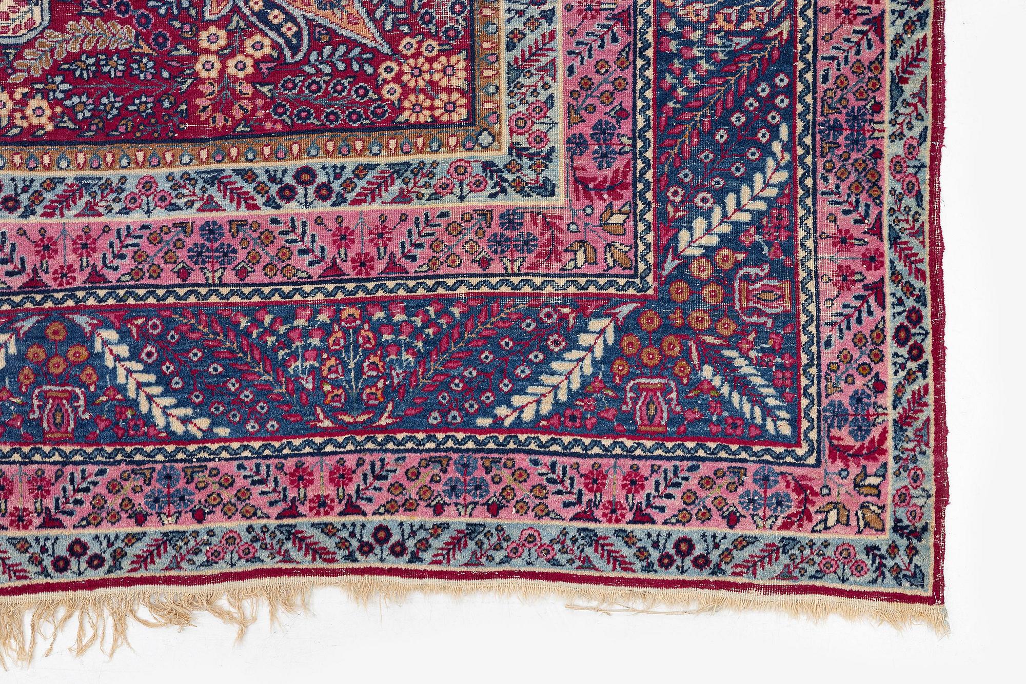 A semi-antique Kirman carpet, South Persia, c. 380 x 289 cm.